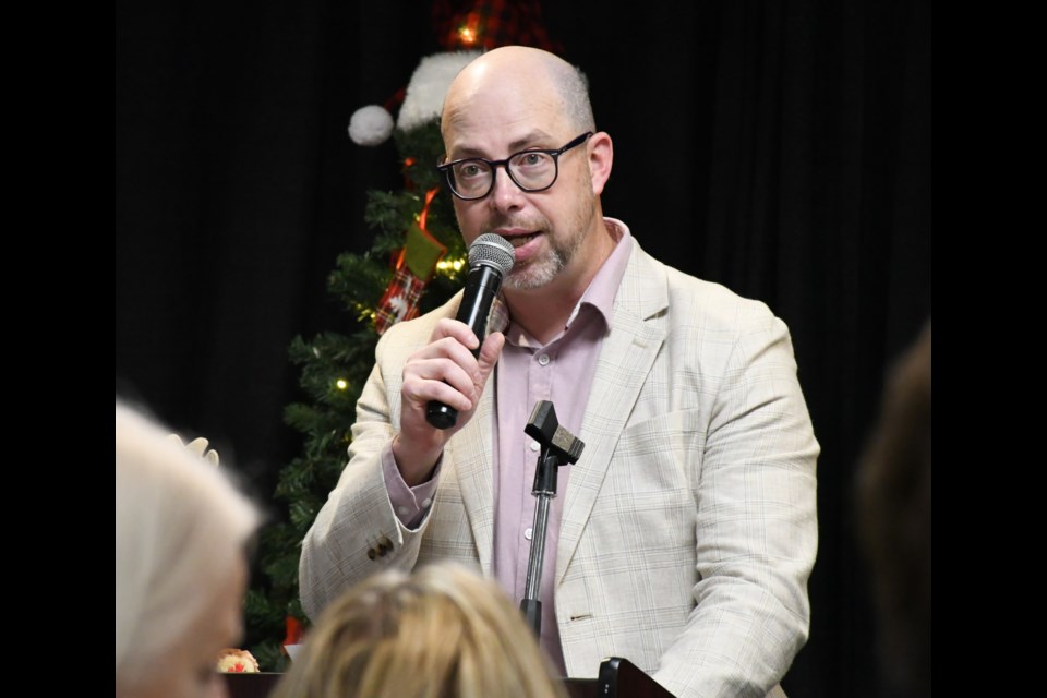 Communications director Craig Hemingway MCs the service luncheon. Photo by Jason G. Antonio