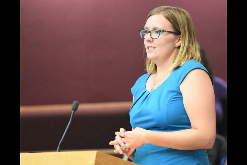 Sarah Regent, parks gardener and co-ordinator of the Beautification Awards program, announces the winners at city council on Aug. 12. Photo by Jason G. Antonio