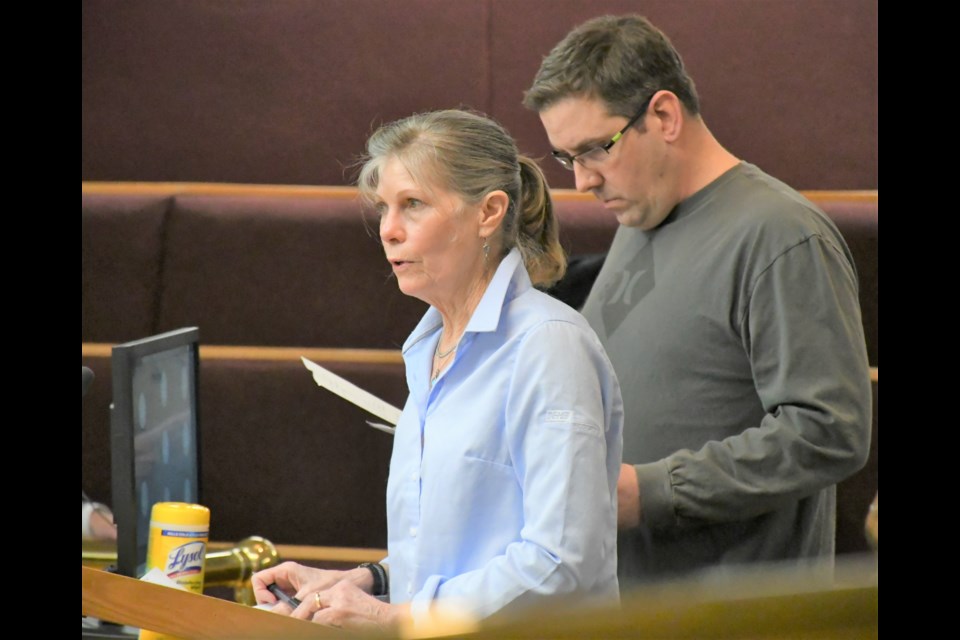 Deb Thorn and Tim Avery speak to council about partially opening the Seventh Avenue Southwest bridge so they can access their properties without having to drive two kilometres through Valley View Centre property to each Highway 2. Photo by Jason G. Antonio 