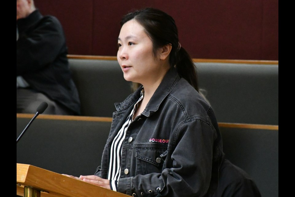 Xixi Cai speaks to city council about her discretionary use application. Photo by Jason G. Antonio