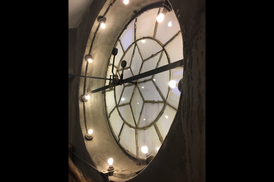 The glass face of the city hall clock tower.