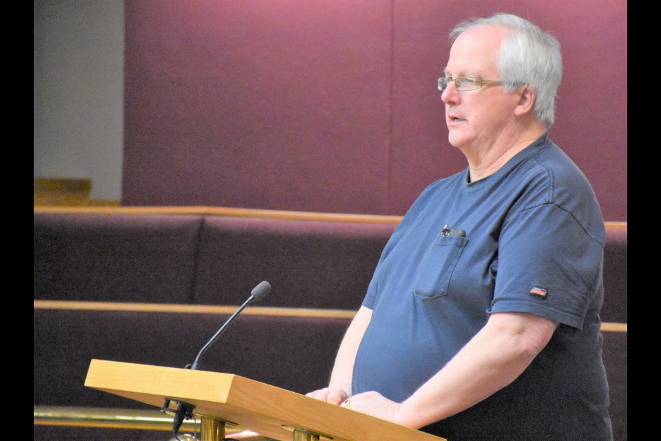 Resident Harold Claffey talks to city council on March 9 about how a historic bell could be restored. Photo by Jason G. Antonio 