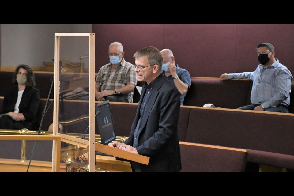 Doug Reichel (at podium) speaks to council about preserving the Coteau Street East bridge. Photo by Jason G. Antonio