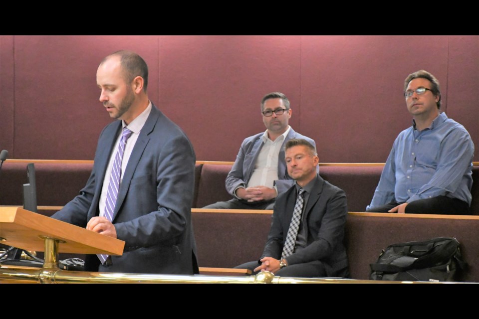 Rory Jensen, acting assistant deputy education minister, speaks to city council about the South Hill school. Also pictured are Derek Hassen, board chair of Holy Trinity Roman Catholic School Division, Sean Chase, education director for Holy Trinity, and Robert Bachmann, board chair of Prairie South School Division. Photo by Jason G. Antonio 