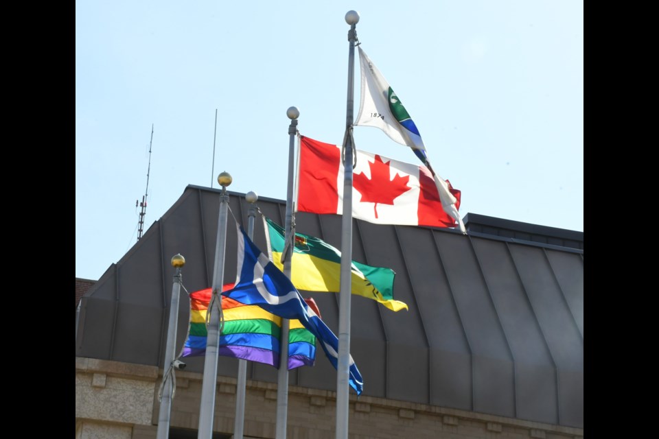 The Moose Jaw Police Service flies the Canadian, Saskatchewan, Treaty 4, Metis and Pride flags outside its headquarters. Photo by Jason G. Antonio 