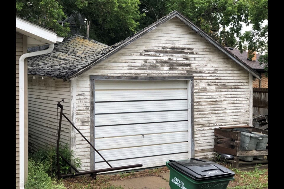 The roof on the garage at 1014 Sixth Avenue Northwest has caved in, but city council will allow the homeowners to replace the top of the structure. Photo by Jason G. Antonio