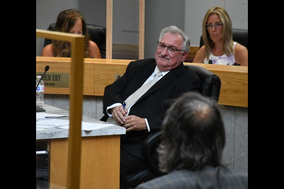 Myron Gulka-Tiechko, city clerk/solicitor, listens to city manager Jim Puffalt (back to camera) praise him for his efforts at city hall since 2008. Photo by Jason G. Antonio 
