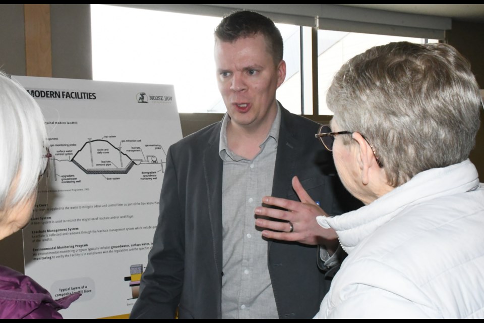 Mark Parker, an engineer with consulting firm GHD Limited, speaks to attendees at the open house. Photo by Jason G. Antonio