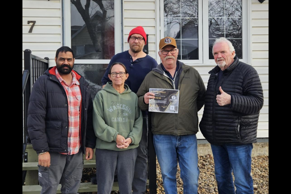 L-R: City of Moose Jaw Bylaw Enforcement Officer Raghvir Gill, Kim and Garth Palmer, Bylaw Enforcement Officer Brian Simmer (back)  and Rob Clark from the Moose Jaw & District Chamber of Commerce