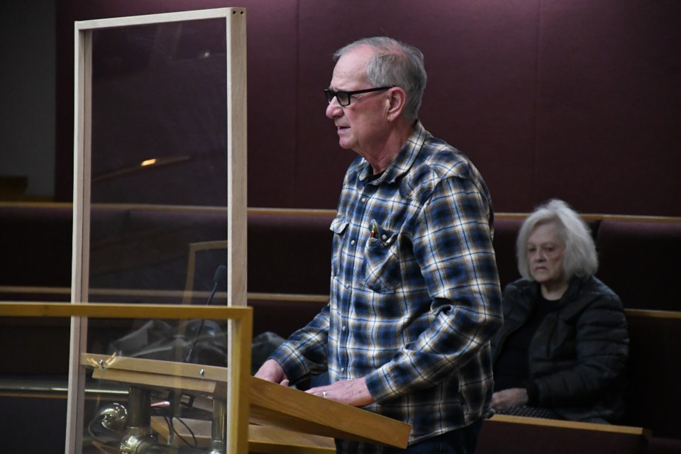 David Paxman, condo board president of The Estates at Creekstone, speaks to city council. Photo by Jason G. Antonio