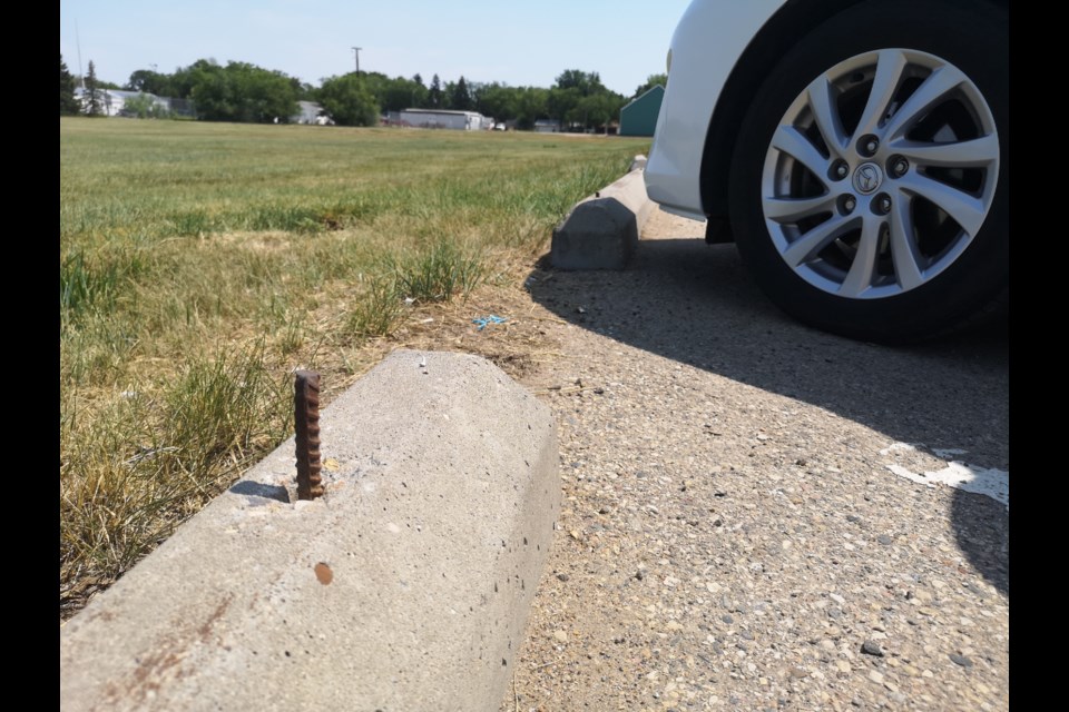 The Moose Jaw Express staff went to check out the parking lot at Kinsmen Sportsplex and we found that there were multiple parking-stall boulevards in the parking lots that had rebar protruding out of them.  