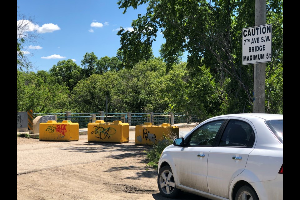 A sign indicates the Seventh Avenue Southwest Bridge should be able to handle five tonnes, but that's unlikely now after floodwaters and ice and damaged the structure in 2015. Photo by Jason G. Antonio 