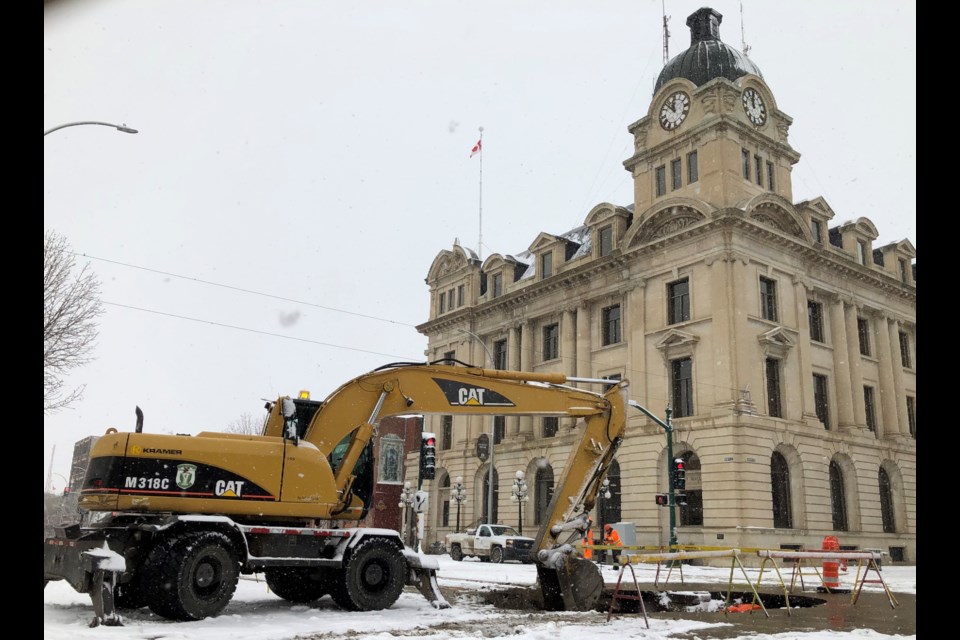 City crews repair a sinkhole at the intersection of Main Street and Fairford Street on March 9. The work will likely be completed on March 10. Photo by Jason G. Antonio 