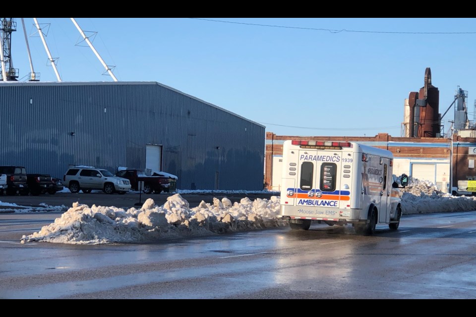 High Street West is now accessible for motorists, but windrows of snow still line the centre median. Photo by Jason G. Antonio