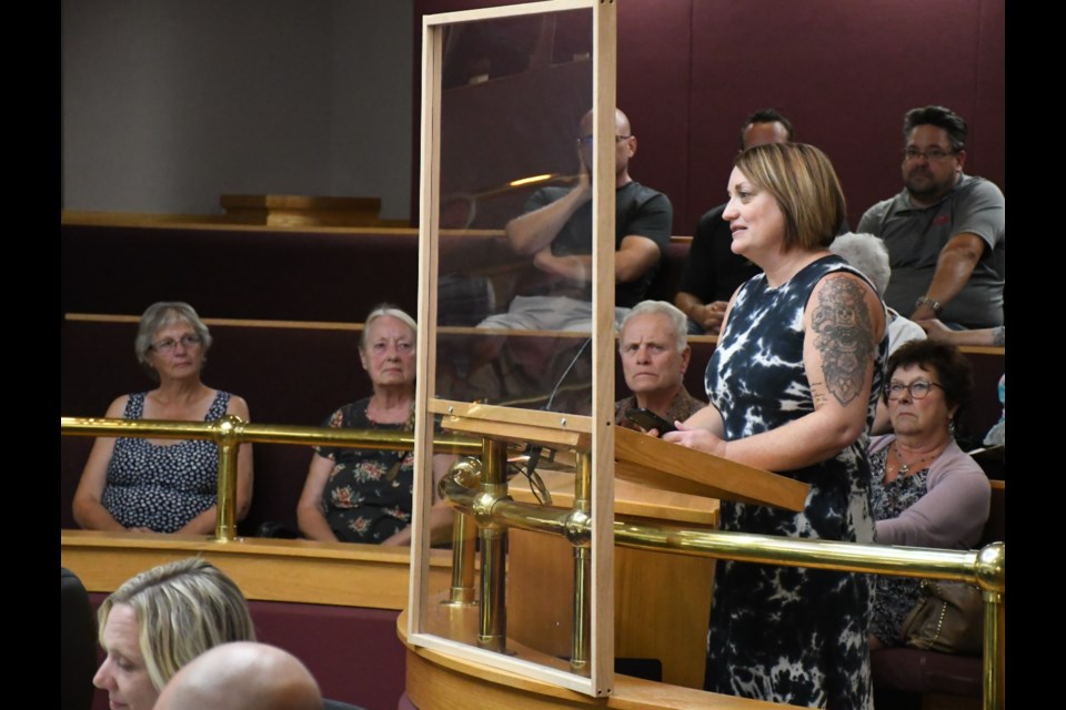 Anna Kwasnica speaks to city council about her concerns with a proposed townhouse project on Stadacaona Street East. Behind Kwasnica in the first row are some of her neighbours. Photo by Jason G. Antonio