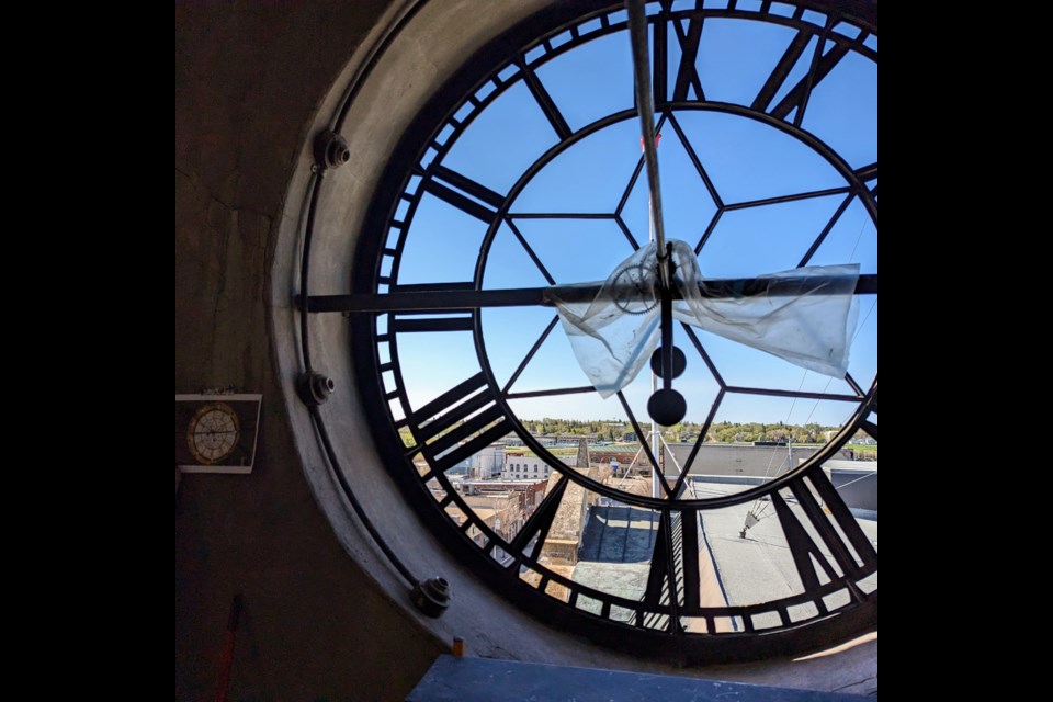 The panes completely removed from the south side of the clock. A diagram taped to the wall numbers each of the panes