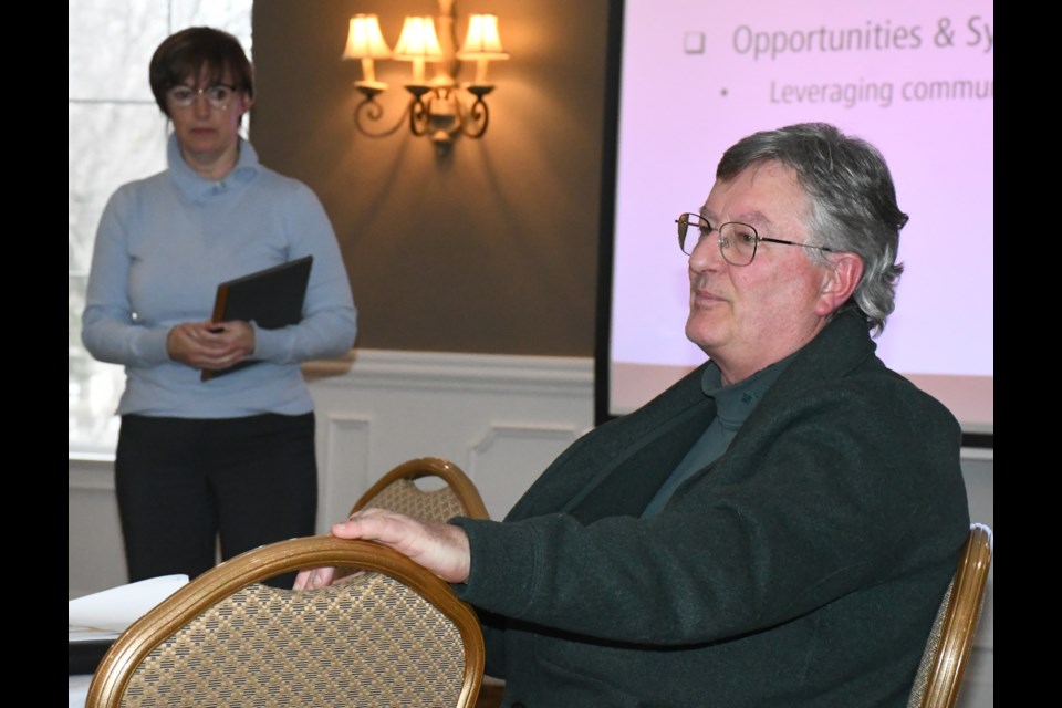 Consultants Allan Wallace (foreground) and his wife Brenda speak to residents about the process for updating the Official Community Plan and the desired feedback the city wants from residents. Photo by Jason G. Antonio 