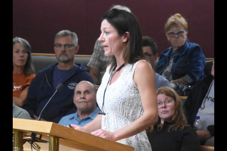 Kristy Van Slyck, a business owner, speaks to council about her concerns with the renewal of a contract for property assessment services. Photo by Jason G. Antonio