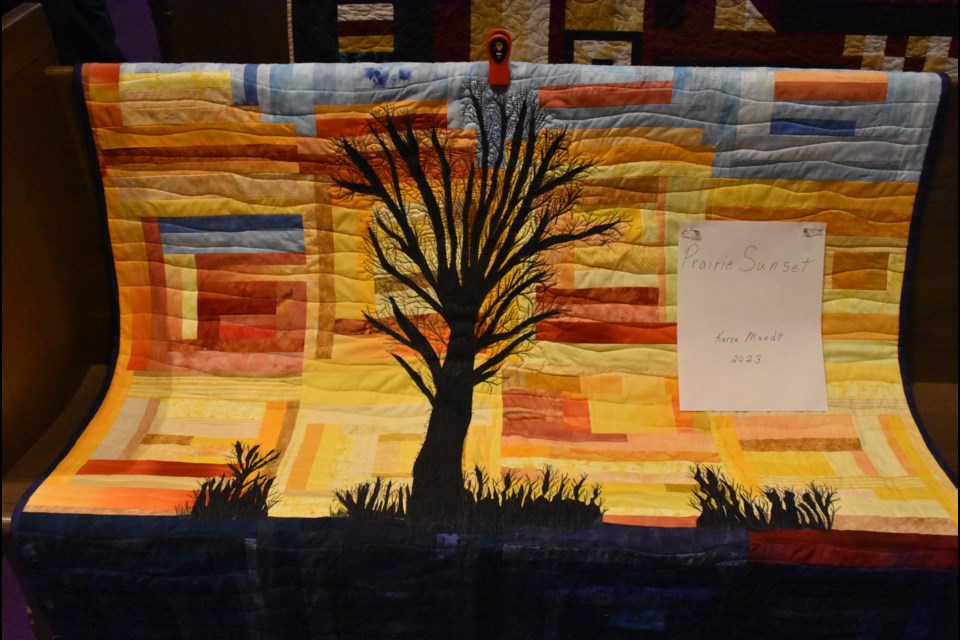 Free-form art quilt titled ‘Prairie Sunset’ by event organizer Karen Mundt