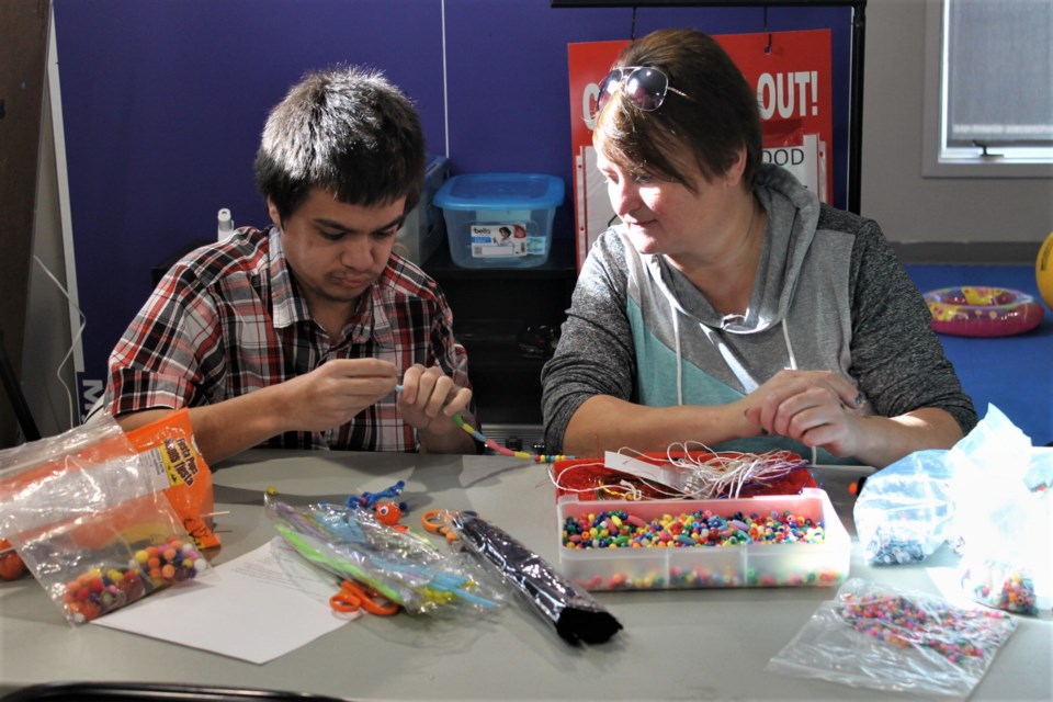 The beading table was busy getting creative. 
