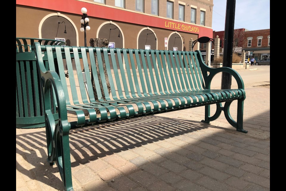 This bench on River Street is one of 16 benches included in a proposed Main Street Adopt-a-Bench Program. Photo by Jason G. Antonio