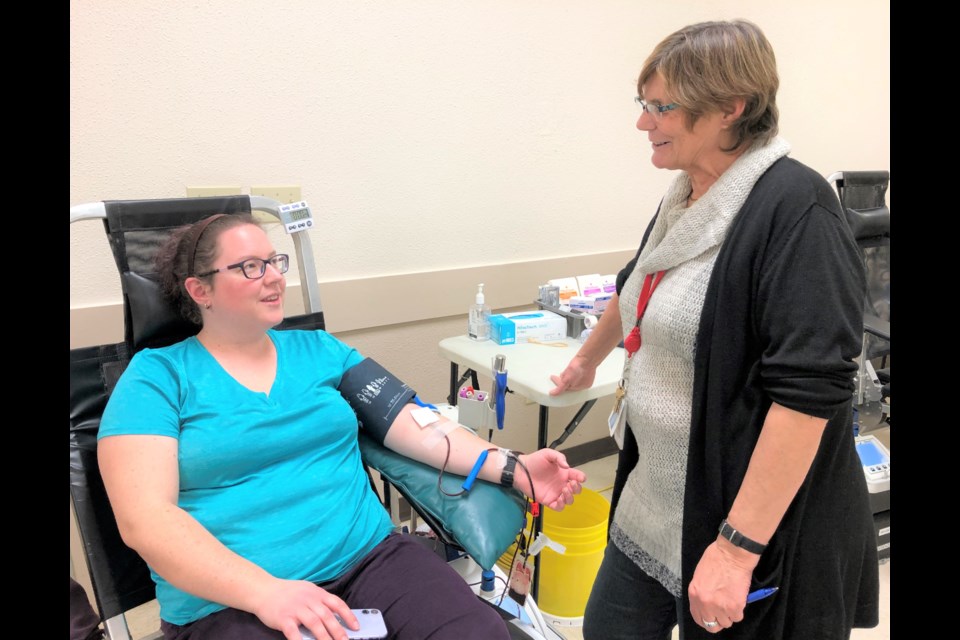 Heather Gardiner (left) speaks with Canadian Blood Services’ Jan Barwell during a clinic at the Golden Nugget Centre on the exhibition grounds on Dec. 3. This was Gardiner’s fifth time giving. Photo by Jason G. Antonio