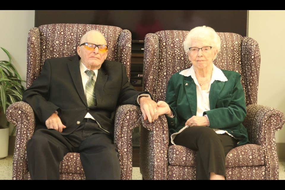 Burton and Clara Bodie celebrated their 75th wedding anniversary recently with a party at Chateau St. Michael’s surrounded by friends and family. They are holding hands, just as they do each night before they go to bed. Photo submitted