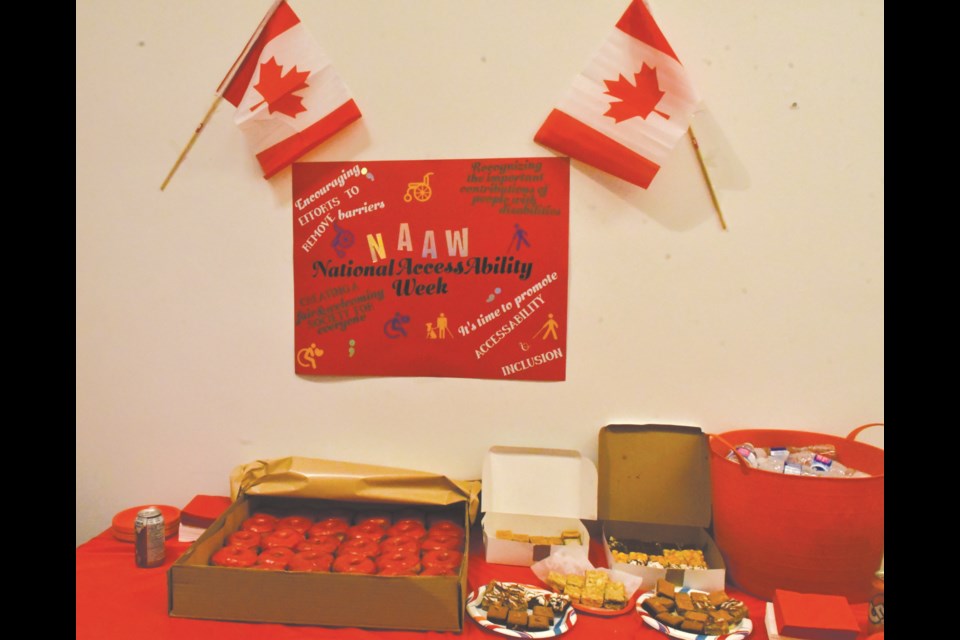 A table full of doughnuts and other tasty desserts help celebrate National AccessAbility Week at the Canadian Council on Rehabilitation and Work office in the mall. Photo by Jason G. Antonio