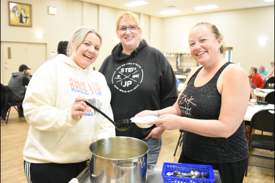 Jen Silzer, Crystal Harvey and Tammy McCleary are the co-organizers of Community Connections, an outreach group that recently expanded its services at St. Aidan Anglican Church. Photo by Jason G. Antonio