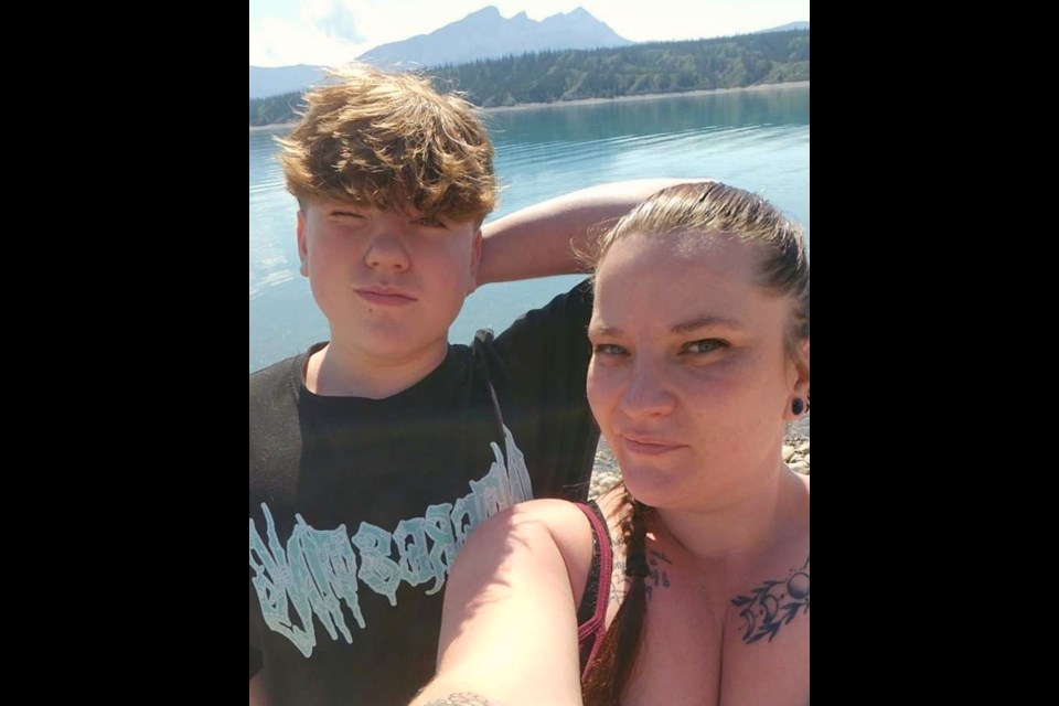 Logan Simpson, left, and his mother Kathy Simpson, right, are pictured during an earlier trip. The family is now facing an uphill journey after Logan was seriously injured in a vehicle accident.