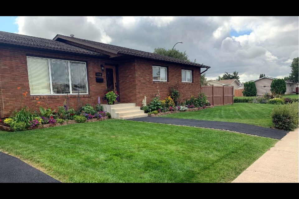 The 2023 Beautification Award for best residential property in South Hill by Elaine Kivol at 1684 - Spadina Dr. 