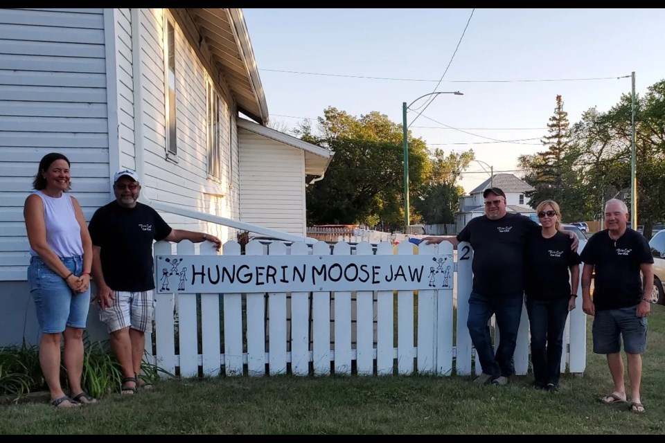 (l-r) Sharla Sept, executive director of Hunger in Moose Jaw, with Those Guys Car Club members Brian Johnston, Kevin Kincaid, Lana Hawken, and Don McDonald