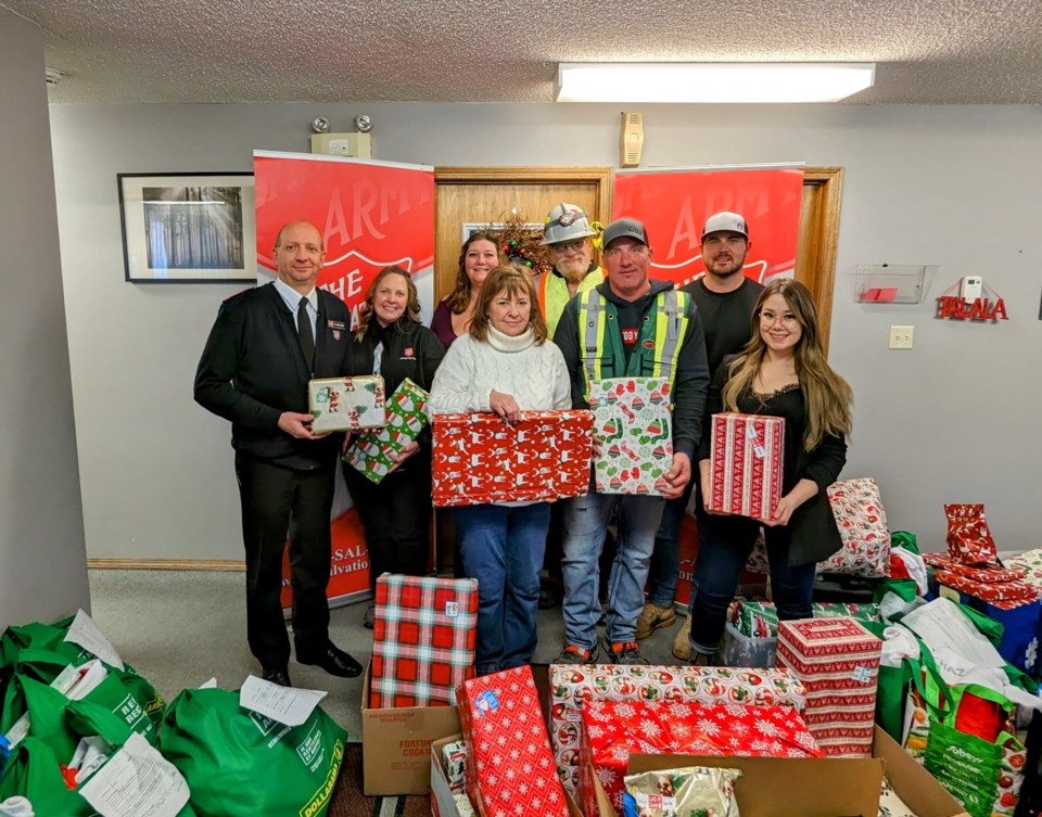group-photo-at-salvation-army-after-great-plains-power-station-crew-drop-off-supplies-for-adopt-a-family-christmas-2022