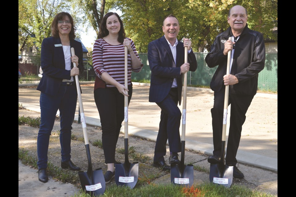 Moose Jaw city councillor Crystal Froese, left, Jenny
Gadd, chairwoman of the East Side Community Association,
Mayor Fraser Tolmie and Gerry Onyskevitch,
general manager of the Moose Jaw Co-op, stand
at the ground-breaking ceremony for the new East
End Spray Park on Aug. 29, 2018. Matthew
Gourlie photograph
