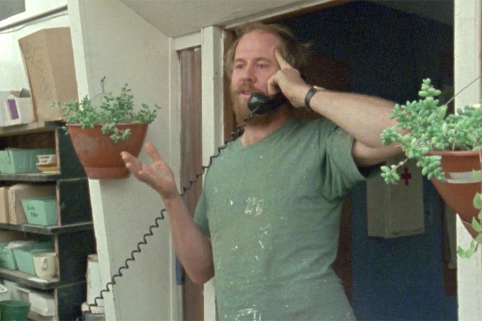 Longtime manager Don Mitchell spends a lot of time on the phone talking to customers throughout the documentary. | NFB screenshot