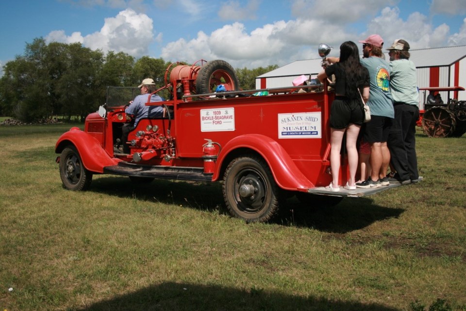 The fire engine was busy all day ferrying youngsters and some adults on tours of the museum grounds.