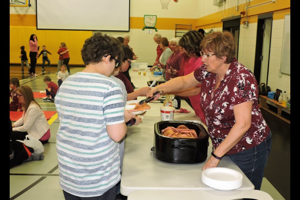 Empire students enjoy pancake breakfast by Friendly City Optimists. (Sasha-Gay Lobban photograph)  