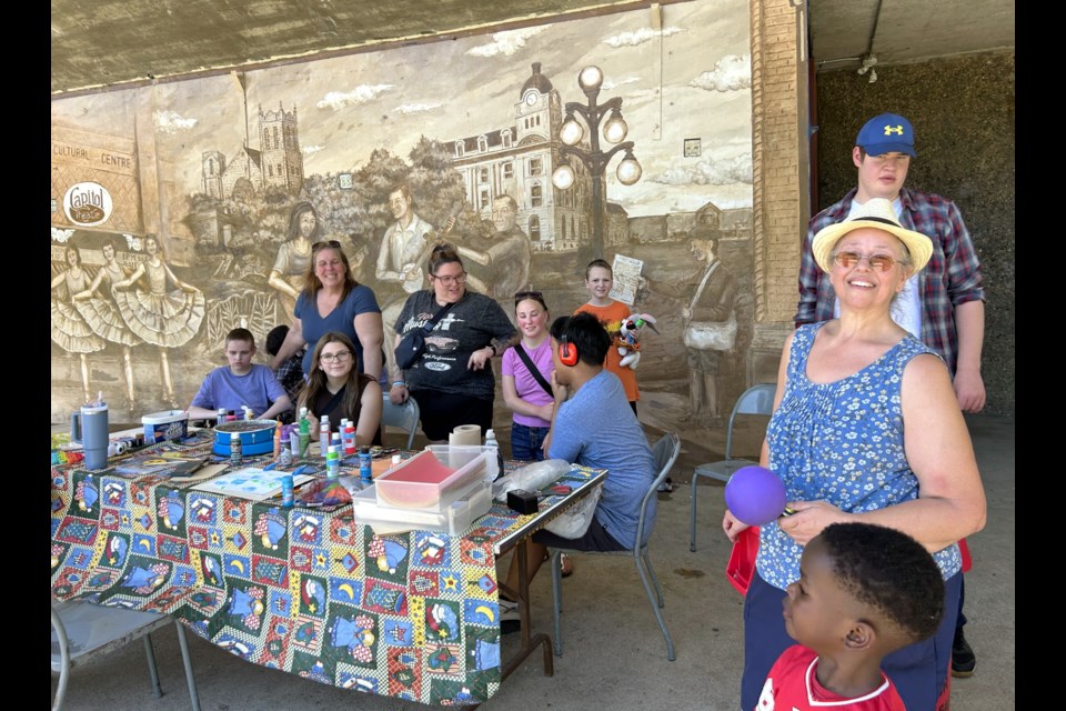 LeeAnn (Grannie Lannie) Rose, right middle, is pictured with Susan Kellock and friends from the Trusting Hands Inclusive Center during a recent art session at the Crescent Park amphitheatre.