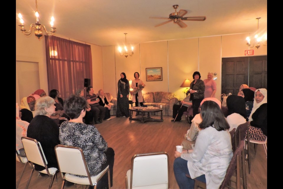 The women gathered in a circle to listen to guest speaker Kelly Beattie. (Sasha-Gay Lobban photo) 