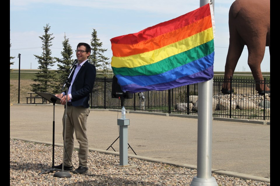 Executive Director of Moose Jaw Pride Joe Wickenhauser, pictured here, asked each guest to give the flag a pull, to get it to the top of the pole. (Larissa Kurz photograph)