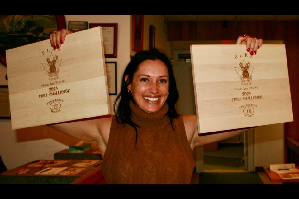 Kelsi Gieni proudly shows off her awards