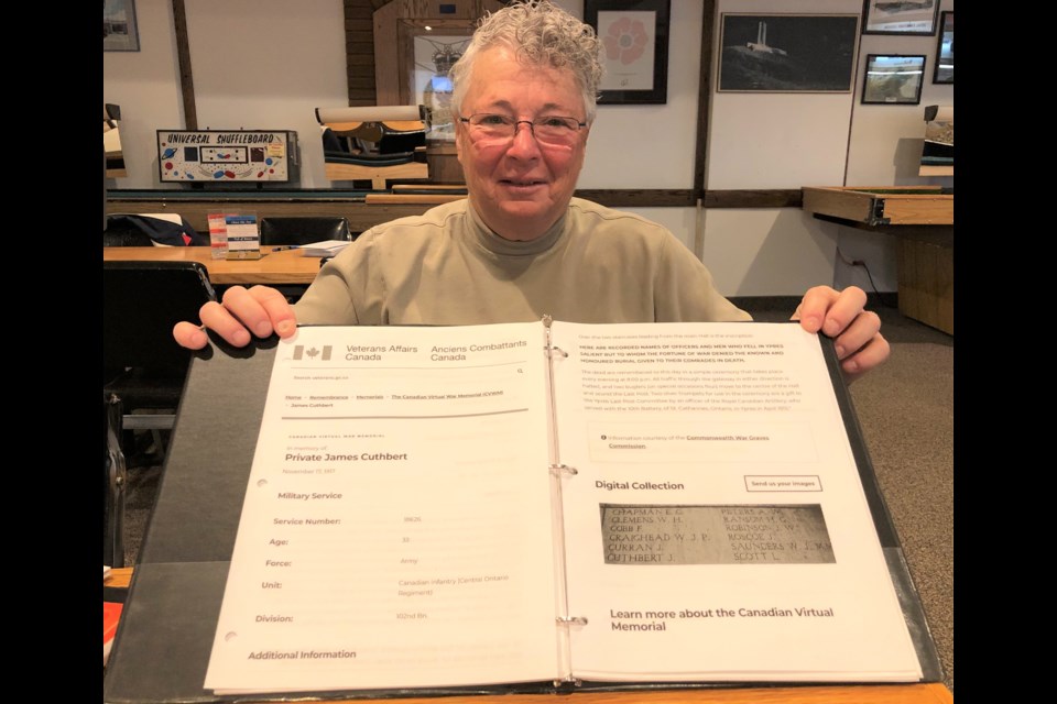 Legionnaire Sue Knox displays a binder filled with about 180 names of area men who fought and died in the First World War. She also has three binders filled with over 380 names of area men who died in the Second World War. Photo by Jason G. Antonio 