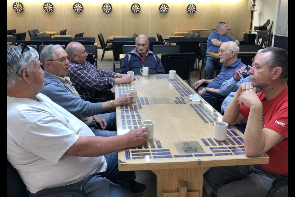 Veterans enjoy coffee hour, which was the first official activity at the new Legion building. Photo by Jason G. Antonio