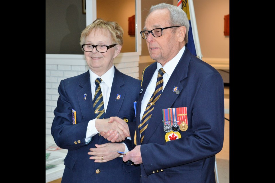 Bruce Hatley, right, received his 50th year of service award from Branch No. 59 president Sharon Erickson at the Royal Canadian Legion Moose Jaw Branch No. 59. (Matthew Gourlie photograph)