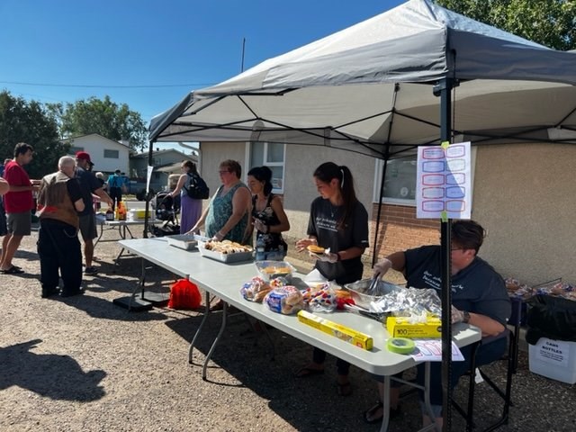 Prepping and handing out the hot dogs and hamburgers  - photo courtesy Moose Jaw and District Labour Council 