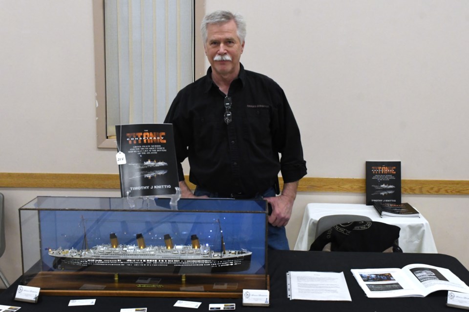 Timothy Knittig, owner of Simcoe Draperies and a hobbyist with a passion for all things R.M.S. Titanic, stands with his display and new book on April 5.
