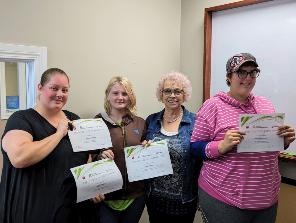 l-r-jessica-holmes-jade-bryson-instructor-doreen-gane-and-brooke-boulanger-at-the-saskabilities-office-with-participants-certificates-of-completion