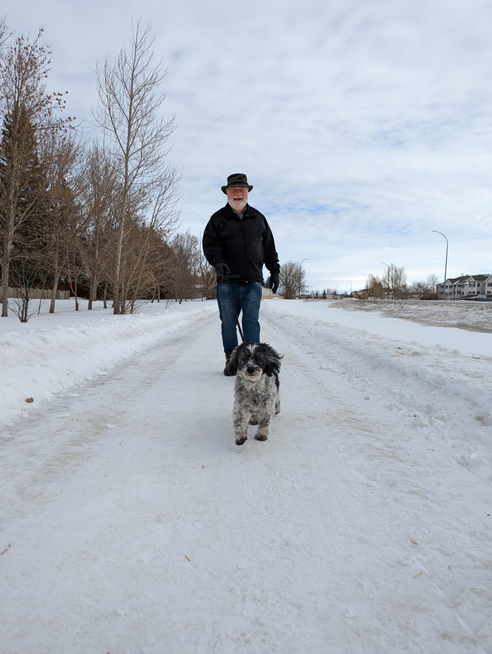 Marco leads Glenn Hagel on their daily walk