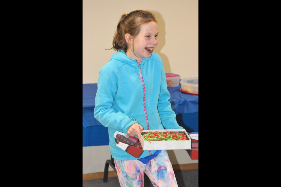 Melina Brandt, 11, reacts after finding out she's off to Disney World through the Make-a-Wish program. Randy Palmer photograph