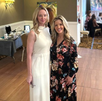 Amber Cameron (left), owner of Radiant Skin Clinic, stands with Darci Lang (right) during the International Women’s Day charity luncheon at the Grant Hall Hotel.